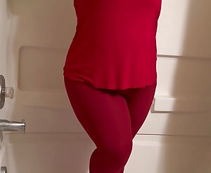 Warm lady desperate to piss in taut crimson yoga trousers