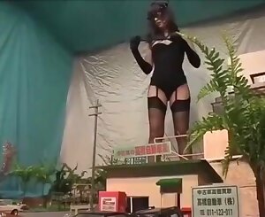 Chinese giantess mistress kicking city in high-heeled shoes and tights